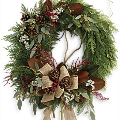 A burlap ribbon and spray of red berries brings a festive touch to this beautifully rustic flat cedar wreath. The perfect addition for your holiday decor!
This wondrous wreath includes flat cedar, curly willow, seeded eucalyptus, and magnolia leaves.