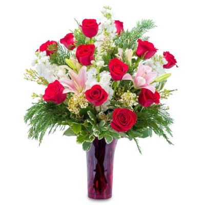 <div class="boatproperty" data-aura-rendered-by="688:0">
<p data-aura-rendered-by="694:0">Beautiful lilies and roses combine with accent flowers and greens for thoughts of winter romance and passion.</p>

<div class="boatproperty" data-aura-rendered-by="677:0"><span class="label" data-aura-rendered-by="678:0">As pictured: </span><span data-aura-rendered-by="680:0">12 Rose, 3 Asiatic Lily, 5 Stock, 2 Waxflower, Variegated Pittosporum, Salal, Cedar, Red Trumpet Vase</span></div>
<div class="boatproperty" data-aura-rendered-by="688:0"><span class="label" data-aura-rendered-by="689:0">Dimensions: </span>Approximately 12"W X 18"H</div>
</div>