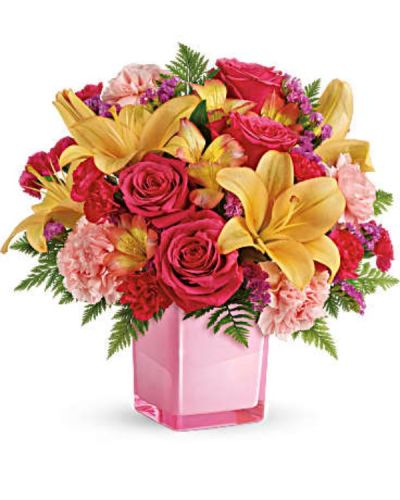<div id="mark-3" class="m-pdp-tabs-marketing-description">Pop go the petals! This festive, fun-loving mix of flowers is a cheerful gift for any occasion. Hand-delivered in a glass cube, these pink roses and bright peach lilies are guaranteed to please!</div>
<div id="desc-3">
<ul>
 	<li>This fresh, fun mix of pink roses, peach asiatic lilies, peach alstroemeria, pink carnations and pink miniature carnations is accented with raspberry sinuata statice and leatherleaf fern.</li>
</ul>
</div>