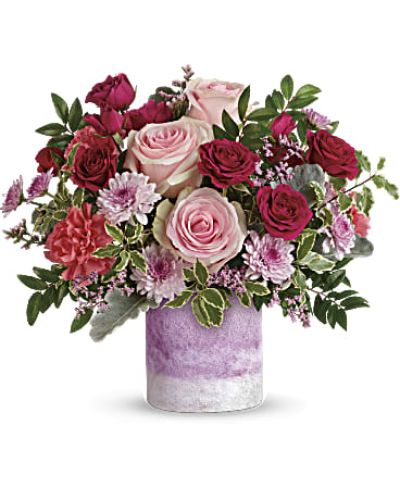 <div id="mark-3" class="m-pdp-tabs-marketing-description">Pretty as can be! Honor their latest accomplishment or celebrate a special day with this fabulous bouquet of pink roses and lavender blooms, hand-arranged in a frosted art glass vase finished in the perfect shade of pink.</div>
<p>&nbsp;</p>
<div id="desc-3">
<ul>
<li>Pink roses, dark pink spray roses, pink carnations, lavender cushion spray chrysanthemums and lavender limonium are arranged with dusty miller, huckleberry and pitta negra.</li>
</ul>
</div>