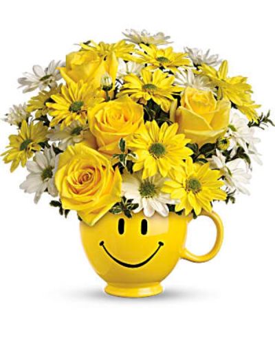 <p>When you're looking to make someone smile, this happy face mug of roses and daisies is tops. Sure to cheer up everyone from a beloved wife to a busy boss, these are also great flowers for kids.<br />
Yellow roses and daisy spray chrysanthemums along with white daisy spray chrysanthemums and oregonia are delivered in a happy yellow happy face mug.</p>