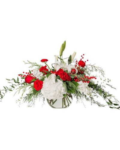 Arrangement as pictured: 3 White Hydrangea, 1 White Oriental Lily, 4 Red Rose, 2 Alstroemeria, 3 Red Ranunculus, 5 White Stock, 2 Ruscus, 3 Red Spray Rose, Assorted Christmas Greens, 3 Salal, 3 Red Artificial Berry, and 6 Red Ornaments in an 8" Bubble Bowl