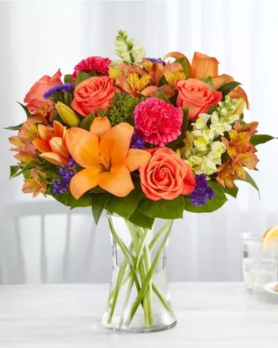<p>Putting a bright start in somebody’s day starts with a beautiful gift. Our delightfully vibrant bouquet is filled with a medley of blooms in cheerful pops of orange, pink and yellow, with plenty of lush greenery mixed in. Designed by the talented Breanna Cartwright from Fresh Ideas Flowers Company in Modesto, California, it’s the perfect pick-me-up surprise, whatever the sentiment.</p>