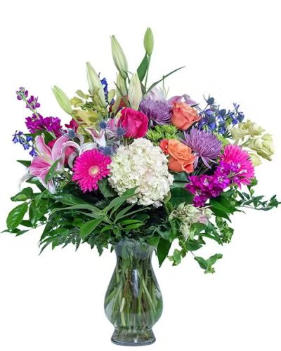 <p>They rock your world. Love You to the Moon will express your devotion. A white hydrangea takes center "space" among stargazers, roses, and other flowers in our Bella vase.</p>