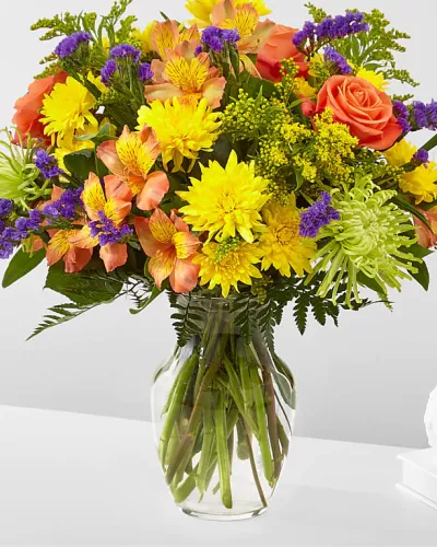 <p>Flowers of yellow and green, and pops of orange and purple. Full of color and texture, all you need is love and our Marmalade Skies Bouquet.</p>