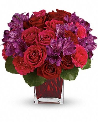 <div class="m-pdp-tabs-description">
<div id="mark-3" class="m-pdp-tabs-marketing-description">Simply breathtaking! Spoil her any day of the week with this decadent gift of red and pink roses, accented with delicate purple alstroemeria and hand-delivered in a gorgeous red glass cube.</div>
</div>
<p id="arrngDescp">This lush arrangement features red roses, dark pink roses, purple alstroemeria, hot pink carnations and galax leaves.</p>