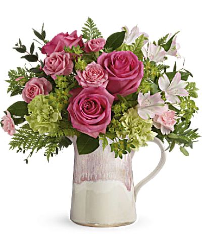<div id="mark-3" class="m-pdp-tabs-marketing-description">Make their heart flutter with an extra special delivery! Hot pink roses and fresh greens look oh-so-chic in this stylish stoneware pitcher, featuring an iridescent reactive glaze in the prettiest shade of pink. It's food-safe for years of enjoyment!</div>
<p>Hot pink roses, pink spray roses, light pink alstroemeria, green carnations and pink miniature carnations are arranged with bupleurum, leatherleaf fern, and parvifolia eucalyptus.</p>