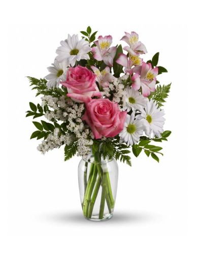 <p>This lovely bouquet of pink roses, pink alstroemeria and white mums in a sparkling clear glass vase is an endearing way to Treat Your Sweet. It is an inspired choice for brightening a birthday, anniversary, special occasion or just because.</p>