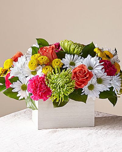 <p>What's the scoop on this bright arrangement Well, our Sorbet Bouquet is curated with a full serving of freshness and fragrance by our local florists to make anyone's day sweeter. This design features roses, spider mums, carnations and poms in a whitewashed wooden box.</p>