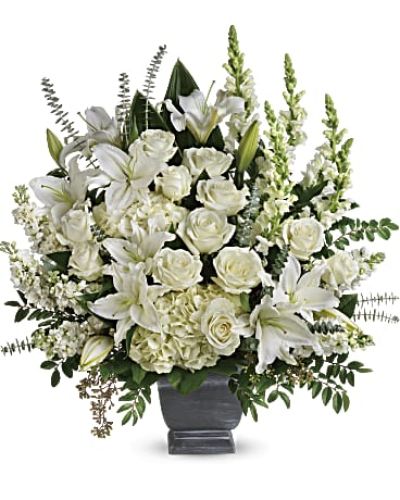 <div class="m-pdp-tabs-description">
<div id="mark-1" class="m-pdp-tabs-marketing-description">Like the sun on the horizon, this pure white bouquet of hydrangea, roses and lilies offers hope and inspiration.</div>
</div>
<p id="arrngDescp">White hydrangea, white roses, white oriental lilies, white snapdragons, and white stock are arranged with huckleberry, seeded eucalyptus, spiral eucalyptus, green ti leaves, and lemon leaf.</p>