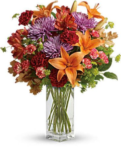 <div id="mark-3" class="m-pdp-tabs-marketing-description">Ring in the season with this fresh, colorful arrangement of lilies and alstroemeria. Hand-delivered in our beautifully crafted vase, it's an easy way to brighten anyone's day!</div>
<div id="desc-3">
<ul>
 	<li>This lovely bouquet includes orange asiatic lilies, dark orange alstroemeria, red carnations, orange miniature carnations, lavender disbud chrysanthemums, bupleurum, lemon leaf and oak leaves.</li>
</ul>
</div>
